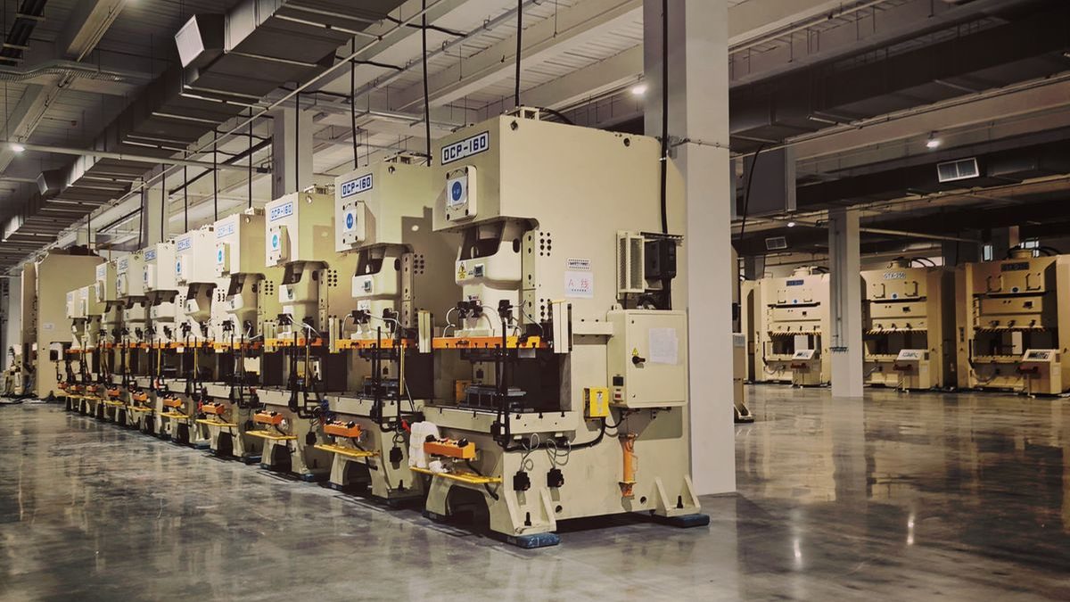 Long production hall inside an Indian electric motor manufacturing plant